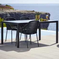 Silla con reposabrazos apilable Breeze weave, Black*Cane-line Outlet
